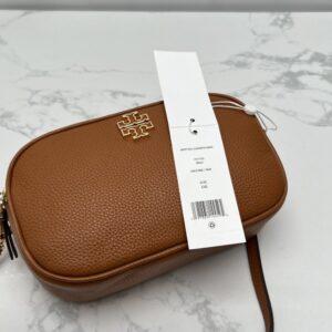 【AT2531】Tory Burchの新しい女性用カメラバッグ、リッチフライトレザー、ショルダーバッグ、斜め掛け小さい丸いバッグ、レザーバッグ、ダブルジッパー。