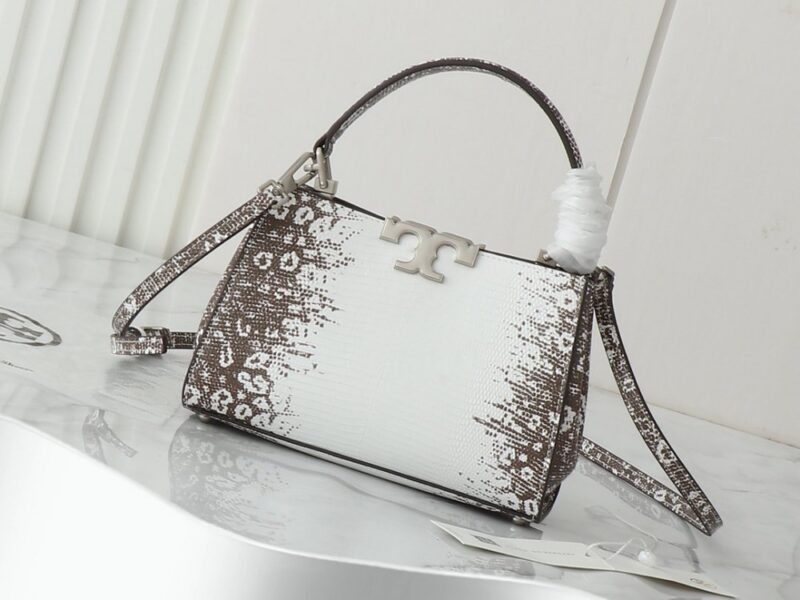 【AT2663】Tory Burchの新作eleanorレザーハンドバッグは、上質なスエードレザートリムが施されています